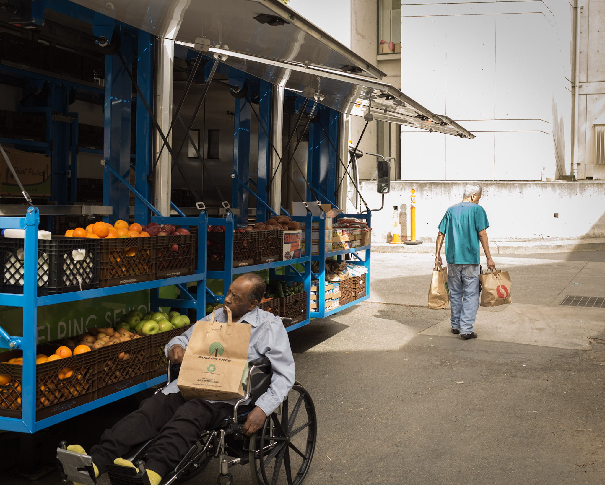 Seniors get groceries at the mobile grocery truck